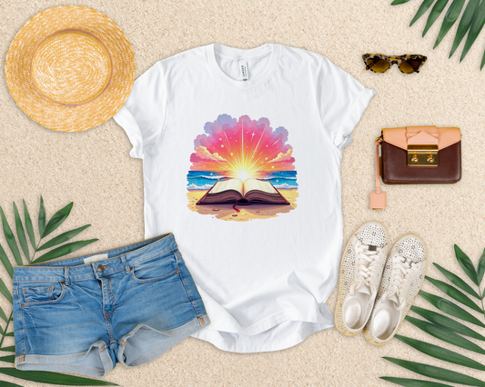 Magical Open Book on Beach with Radiant Flashlight Graphic T-Shirt