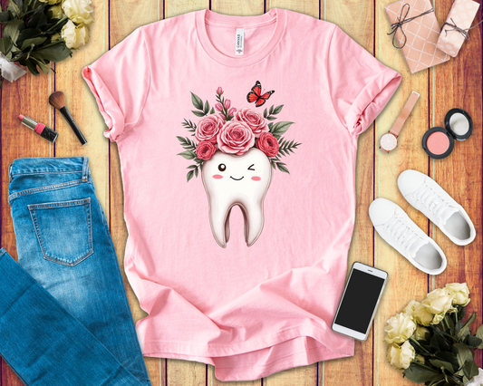 Smile T Shirt with Large Winking Tooth Surrounded by Flowers Leaves and Butterflies