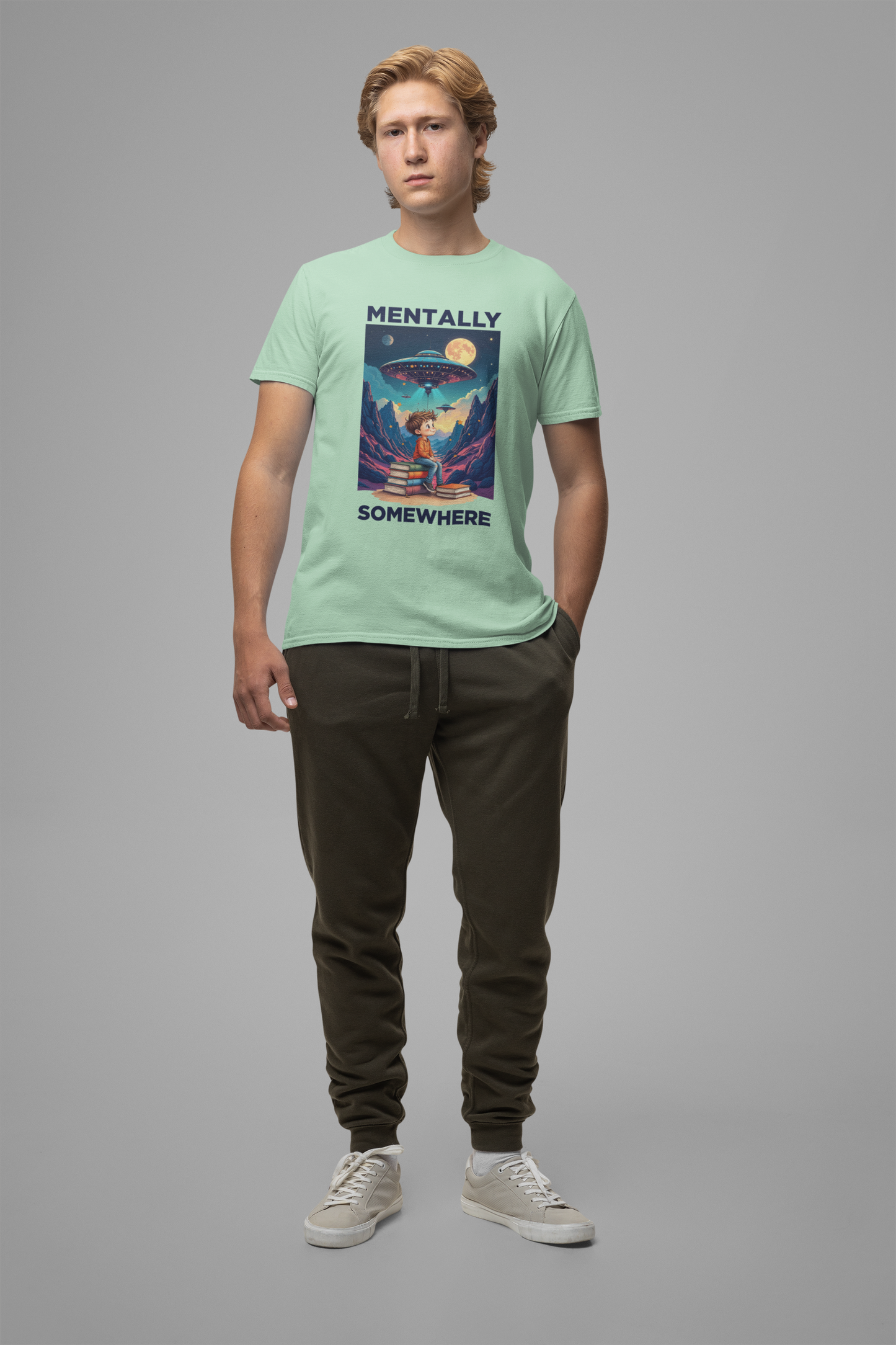 Mentally Somewhere Else – Boy on Books with Space Scene Graphic T-Shirt