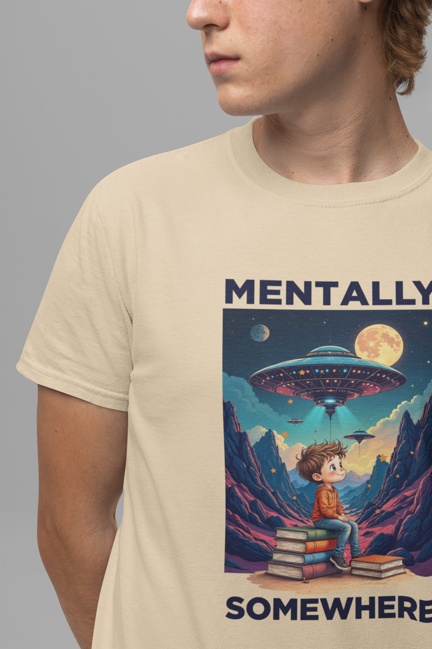 Mentally Somewhere Else – Boy on Books with Space Scene Graphic T-Shirt