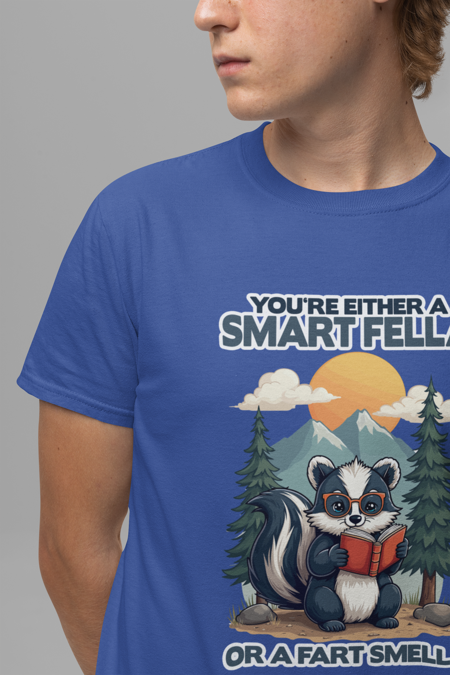 You're Either a Smart Fella or a Fart Smella Tshirt – Skunk in Colorful Space Suit with Sun & Mountain Background
